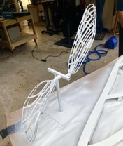 White-painted small-scale prototype dragonfly assembly built to show the artists