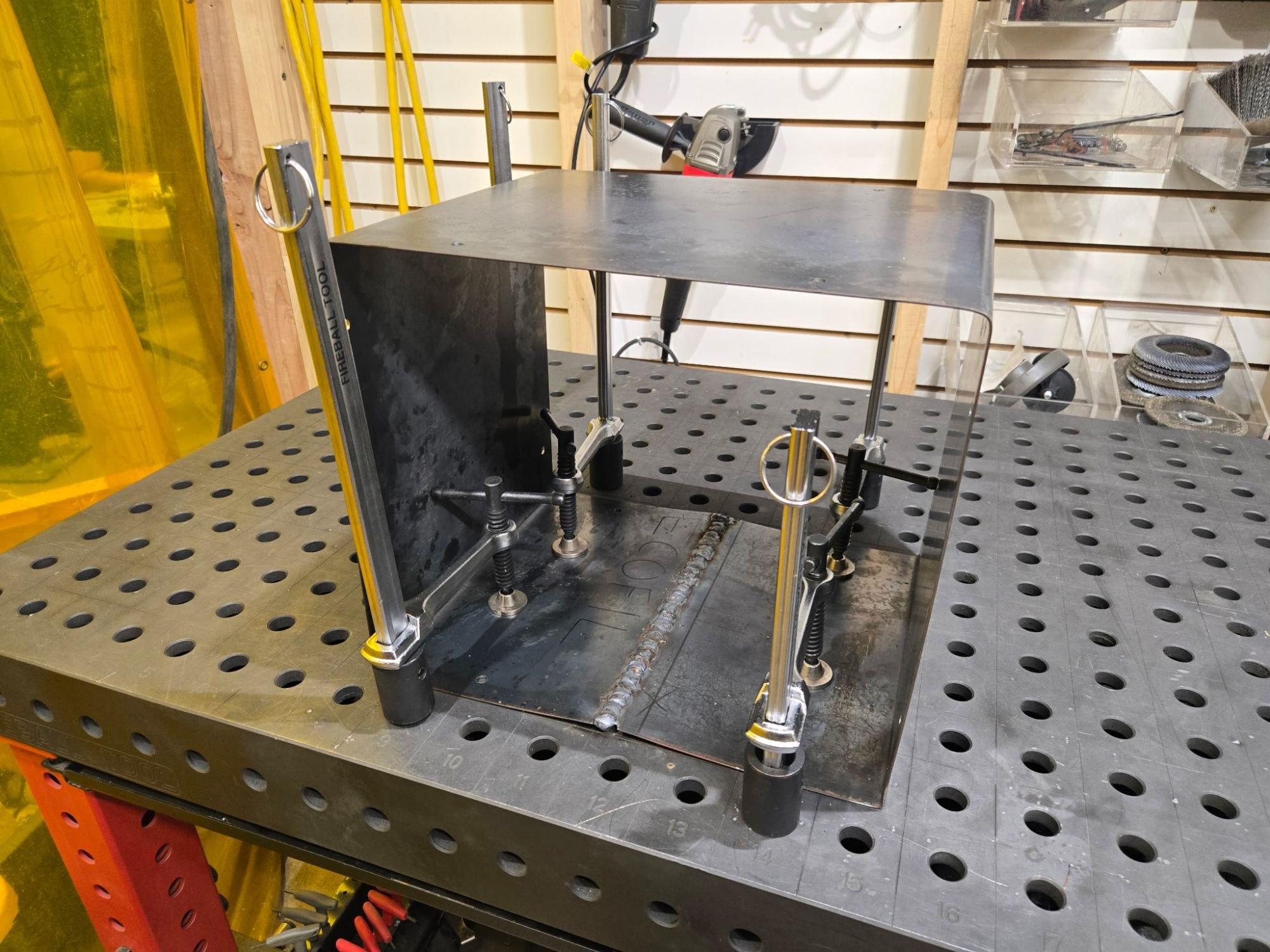Welded ECOFIL dehydrator housing clamped on a Fireball welding fixture table
