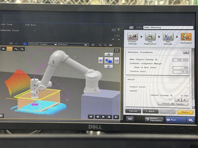 Path planning screen showing a simulated cobot arm above a scanned bin with approach trajectory and detection conditions