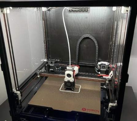 A PLA part printing on an enclosed Voron 2.4 3D printer