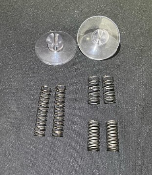 Sourced compression springs in two stiffnesses alongside suction-cup feet